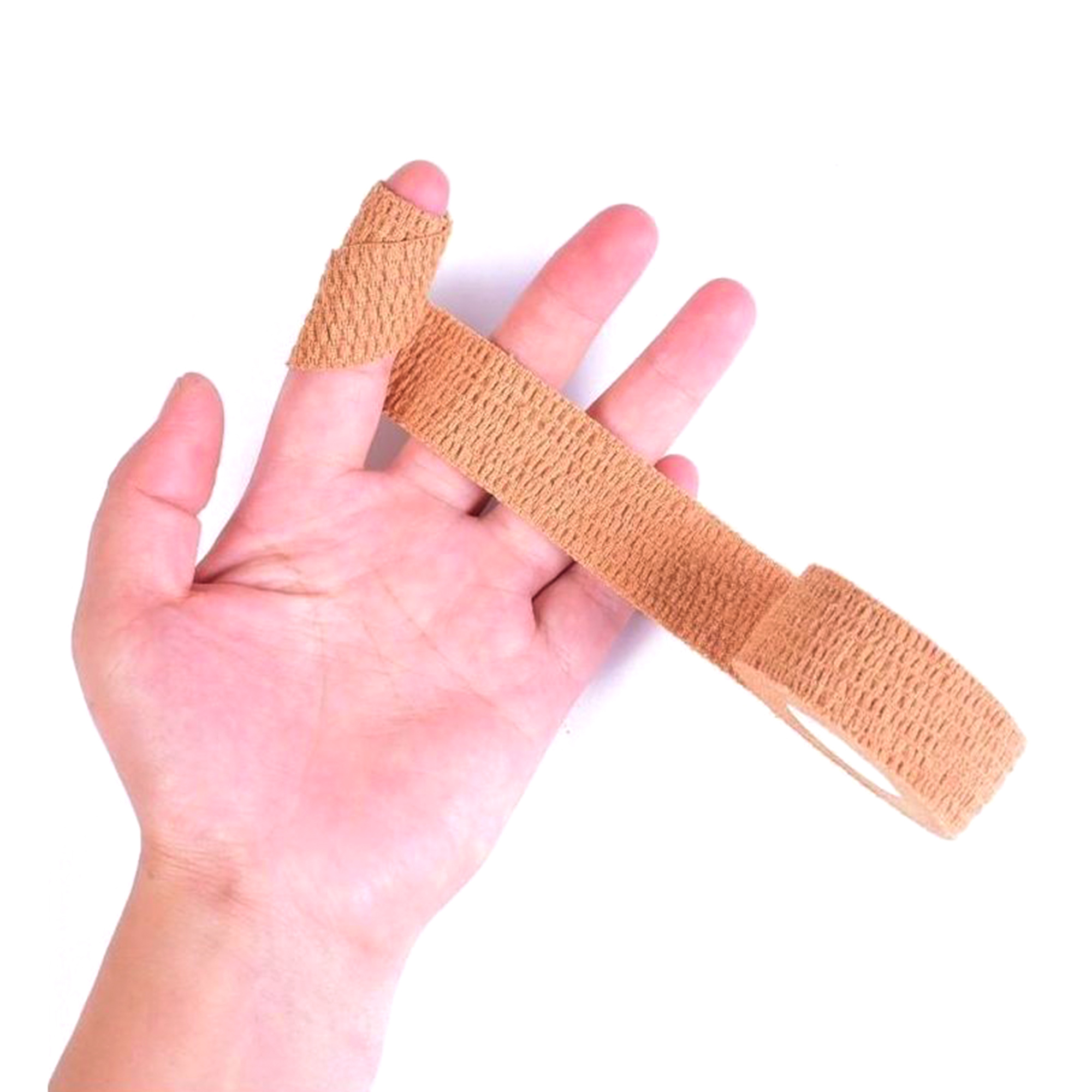 Beige self-adhesive bandage wrapped around a finger