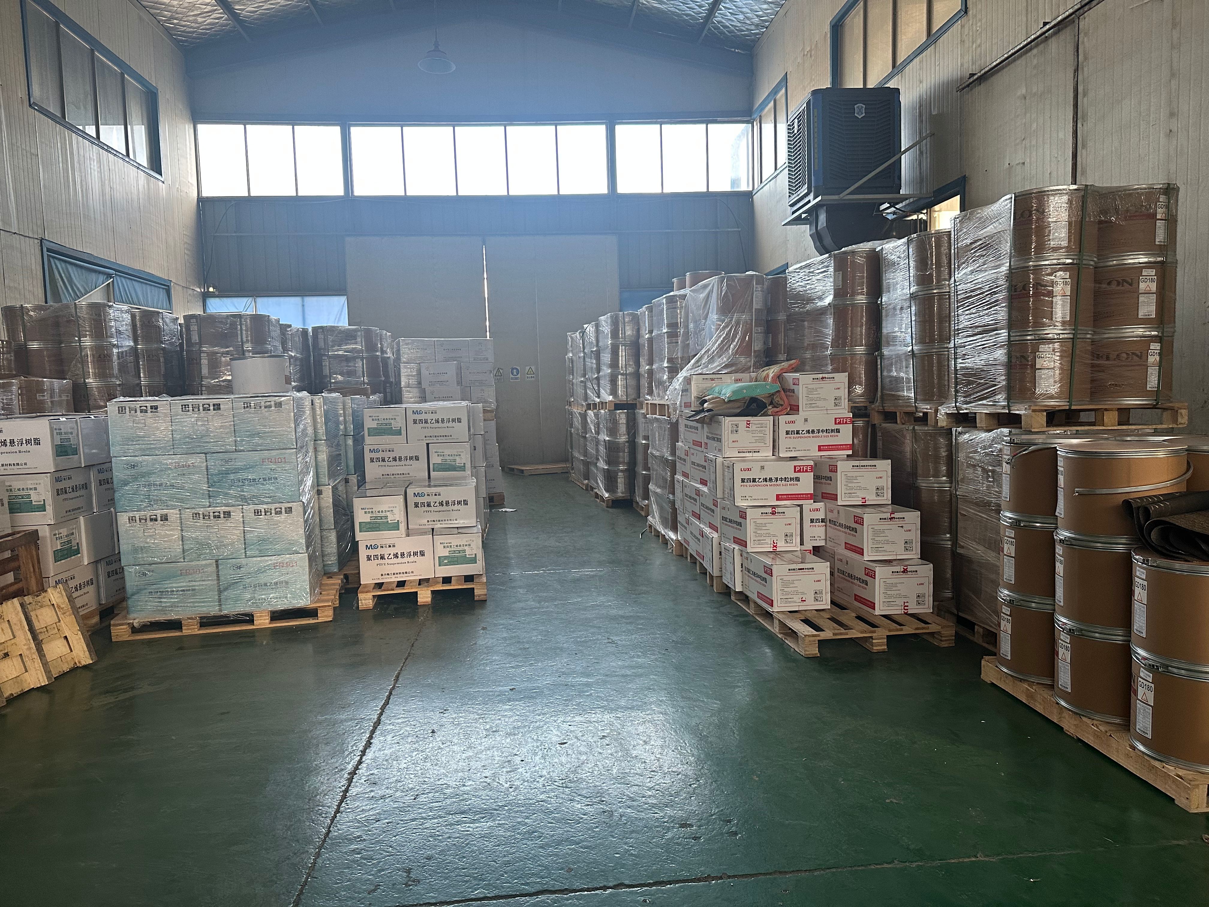 Raw materials warehouse with PTFE and chemical supplies