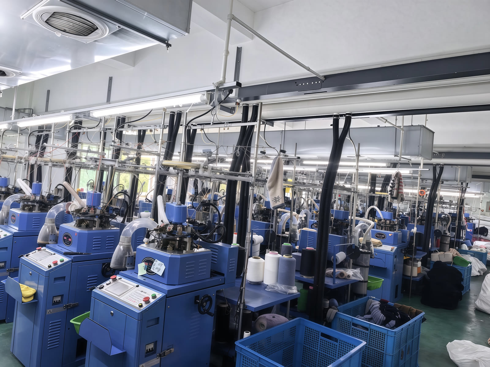 Circular sock knitting machines in the workshop