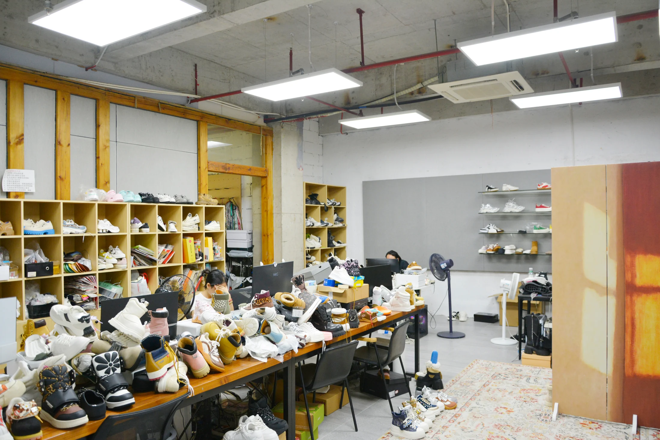 Design and sample storage studio with shelves of sample shoes