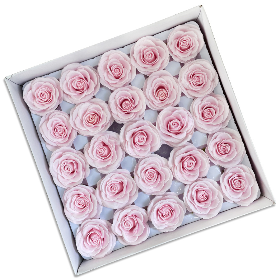 Tray of rose heads in pink and red tones