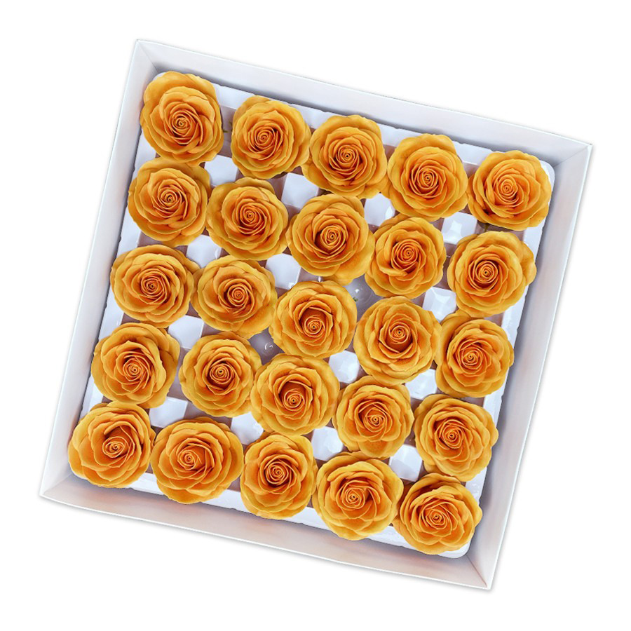 Tray of rose heads in cream, peach and amber tones