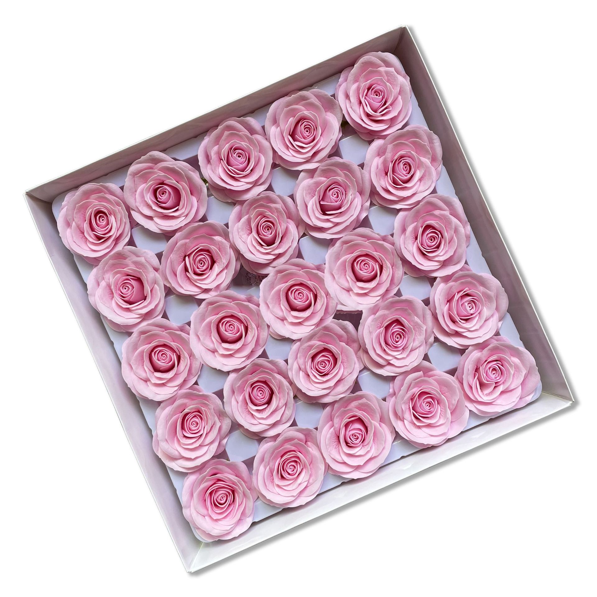 Tray of rose heads in pink and red tones