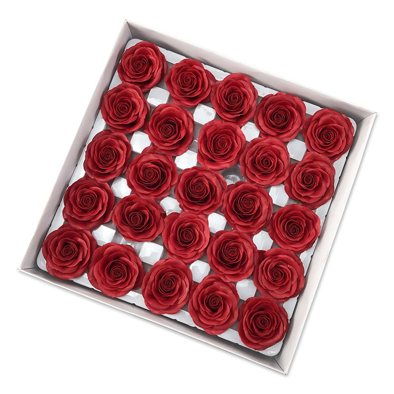 Tray of rose heads in pink and red tones