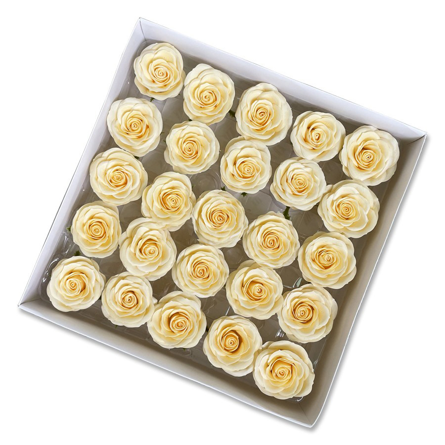 Tray of rose heads in cream, peach and amber tones