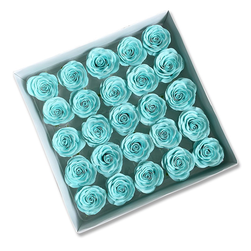 Tray of rose heads in blue and teal tones