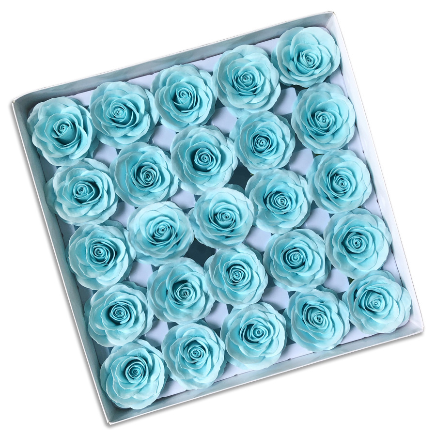 Tray of rose heads in blue and teal tones