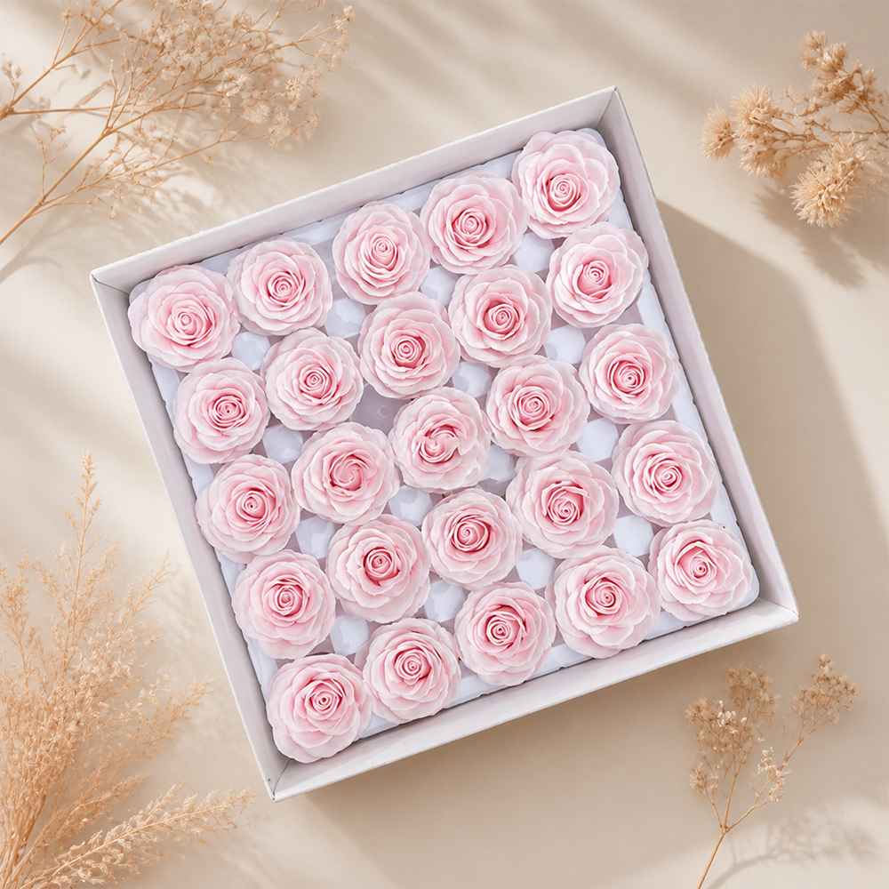 Tray of rose heads in pink and red tones