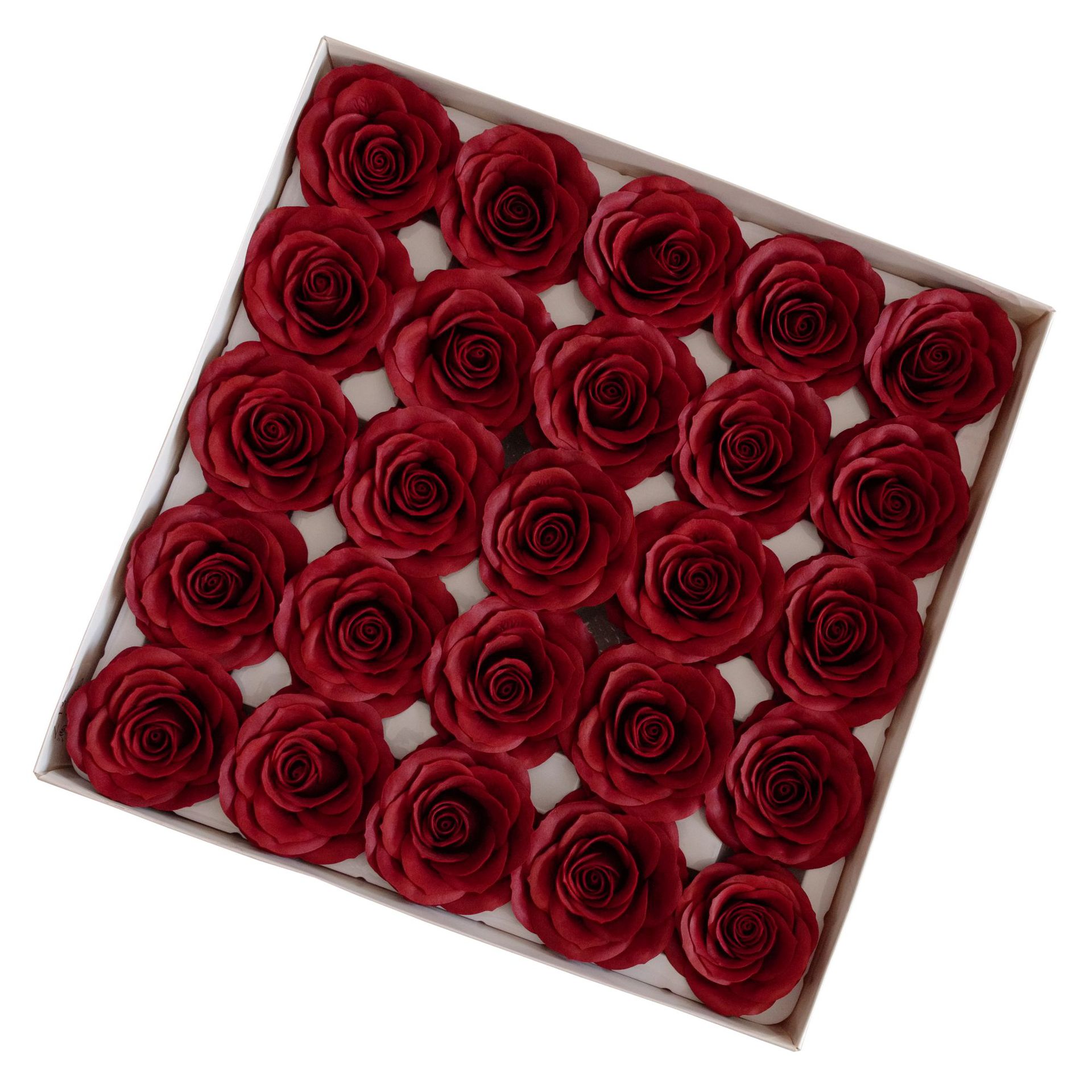 Tray of rose heads in pink and red tones