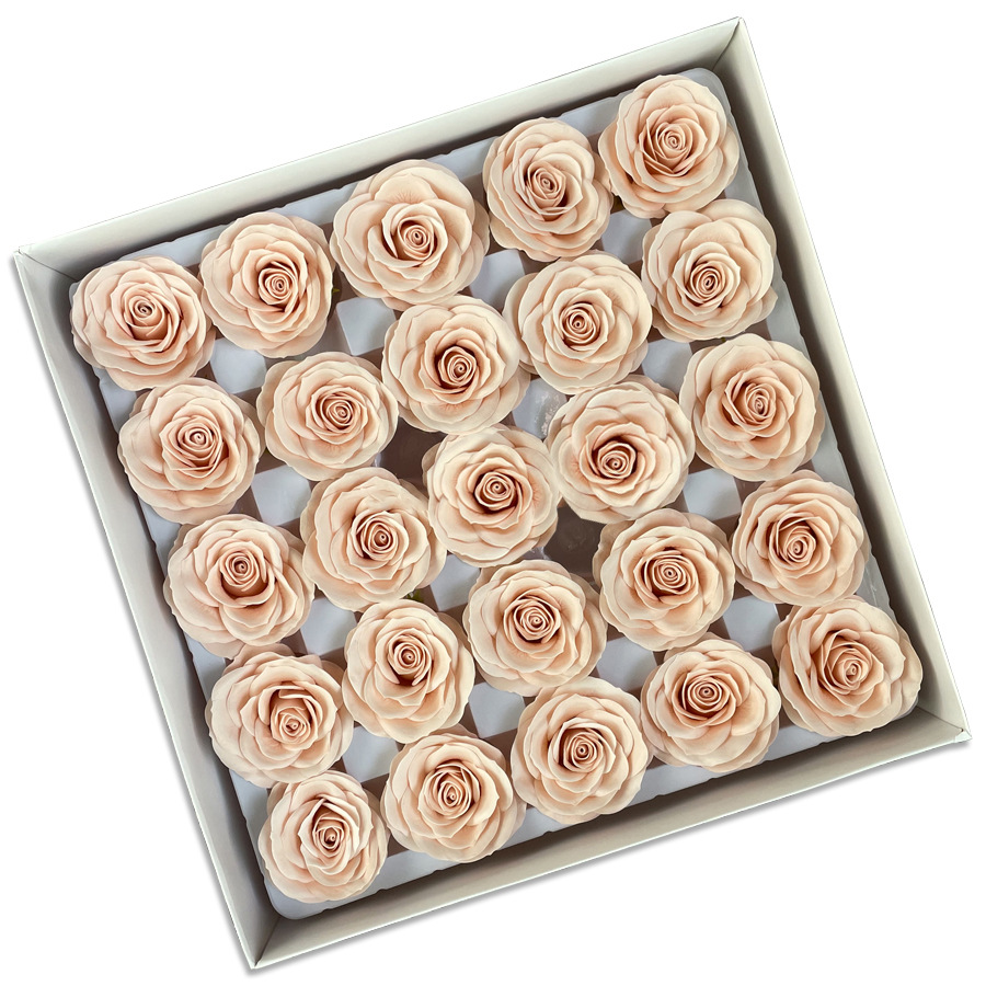 Tray of rose heads in cream, peach and amber tones