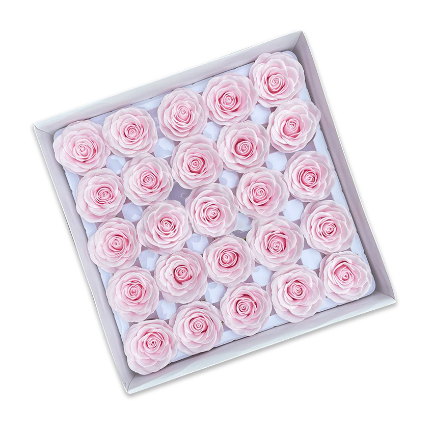 Tray of rose heads in pink and red tones