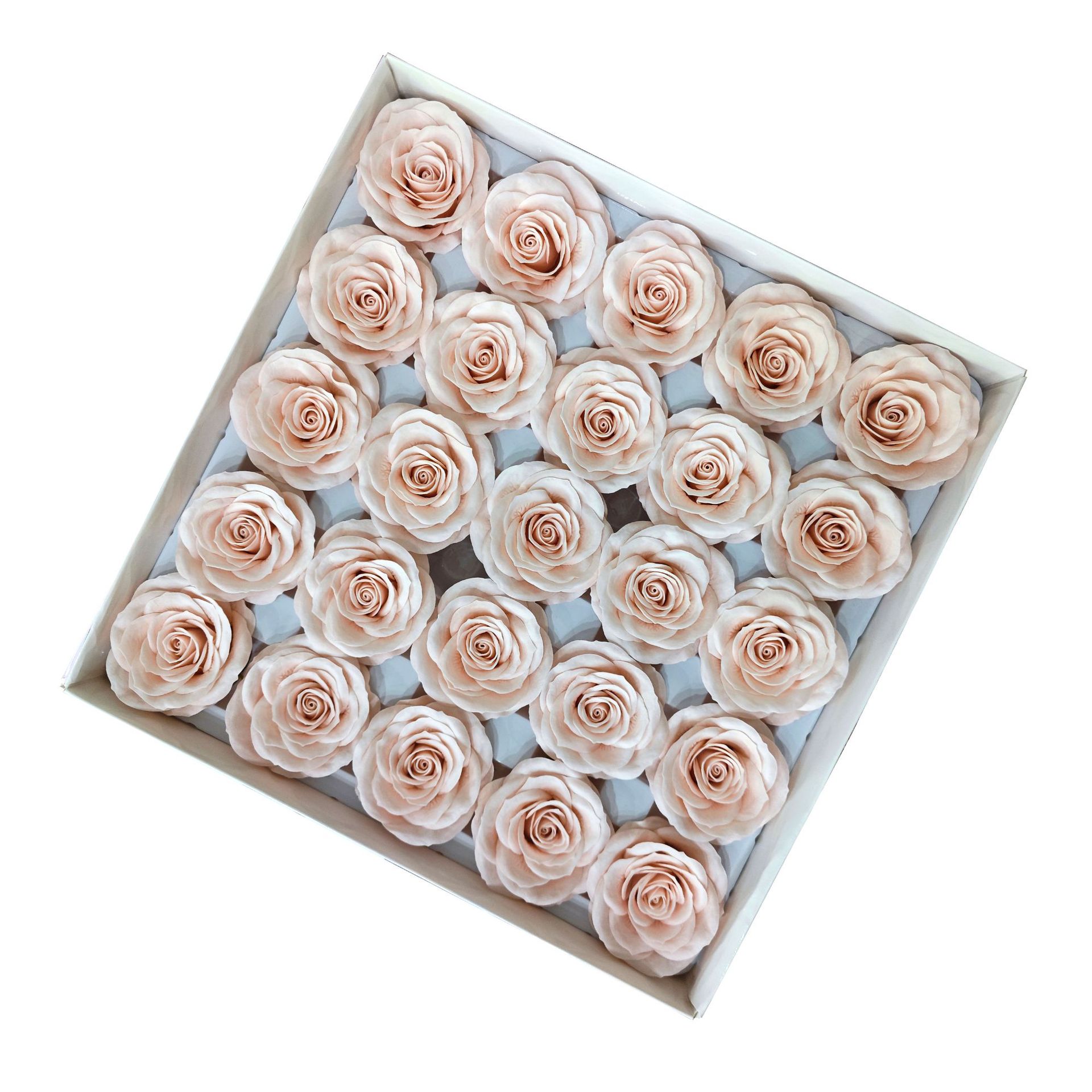 Tray of rose heads in cream, peach and amber tones
