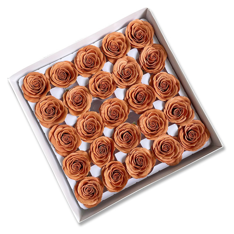 Tray of rose heads in cream, peach and amber tones