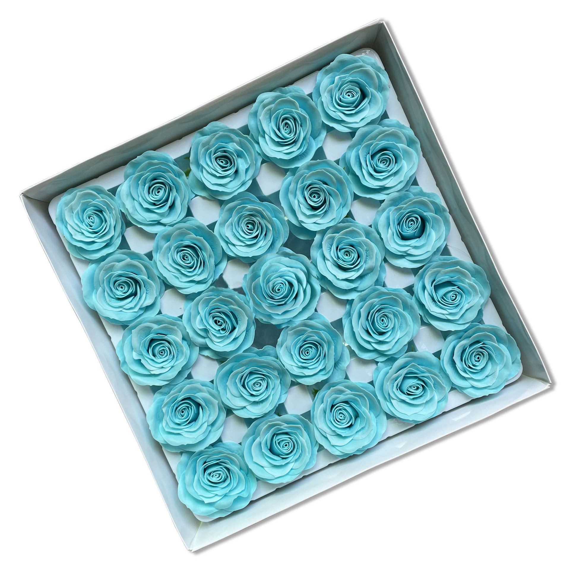 Tray of rose heads in blue and teal tones