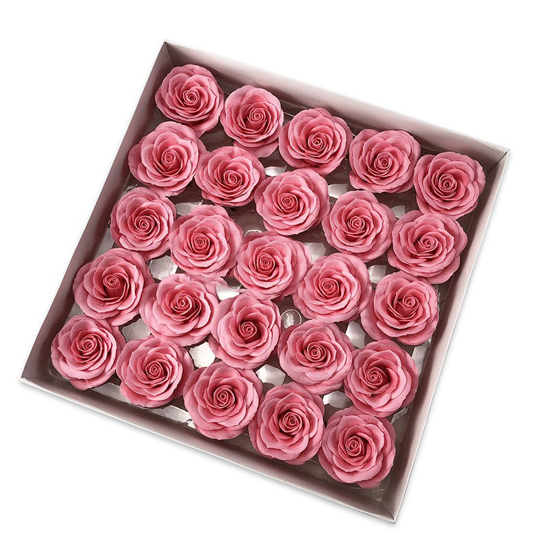 Tray of rose heads in pink and red tones