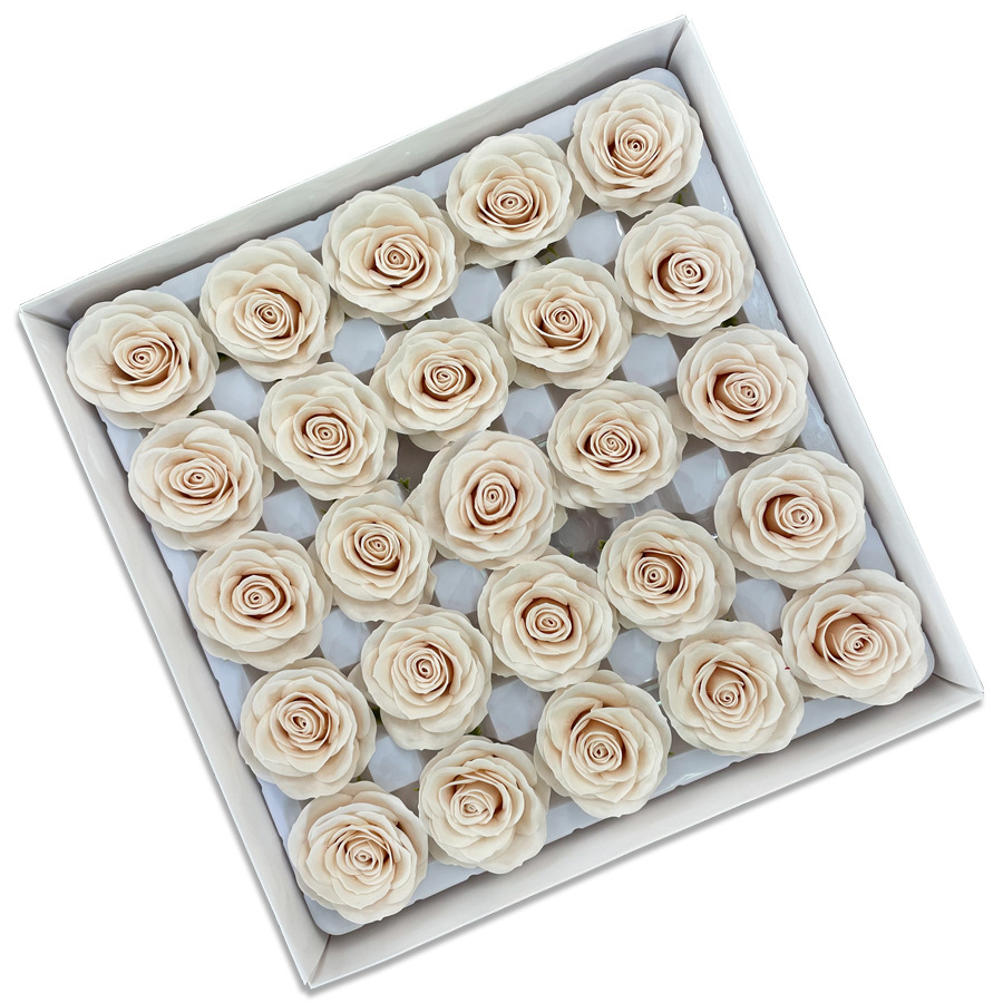 Tray of rose heads in cream, peach and amber tones