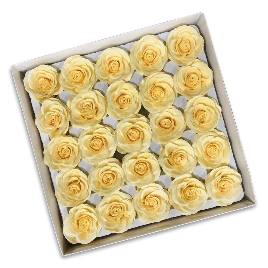 Tray of rose heads in cream, peach and amber tones