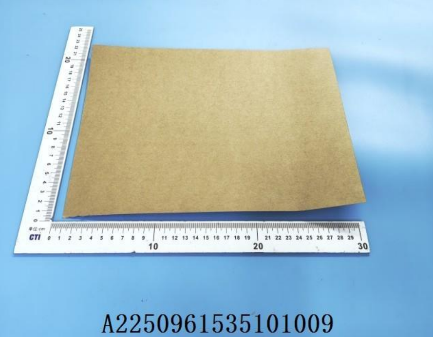 Warehouse aisle lined with rolls of kraft and white paper