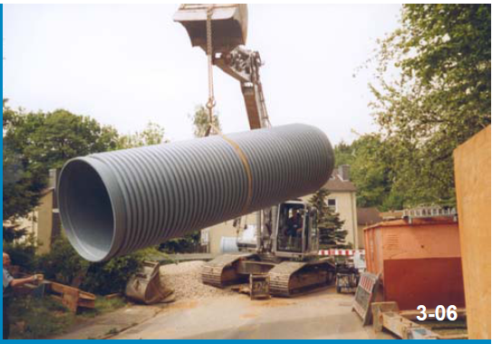 Large pipe section lifted into position on site.