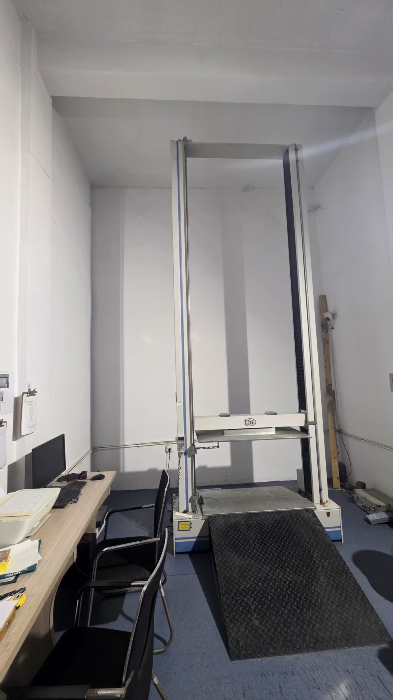 Vertical test equipment in the inspection area.