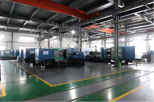 Industrial equipment arranged along a clean factory aisle.