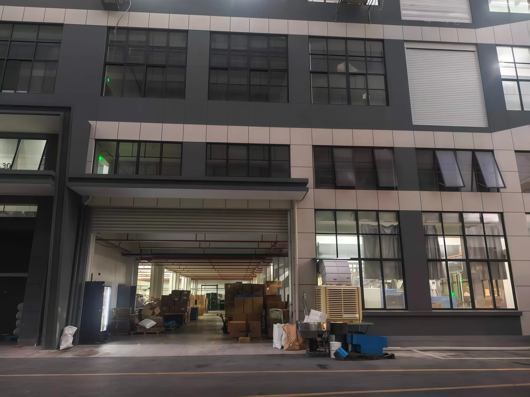 Industrial building entrance with an open ground-floor bay