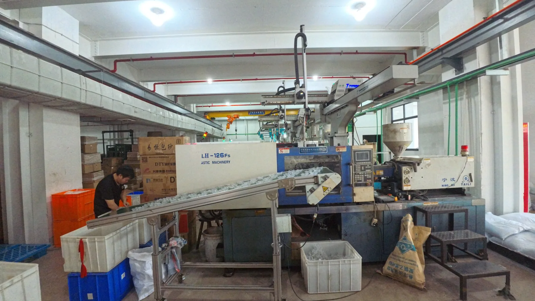 Operator working beside a machine in the workshop