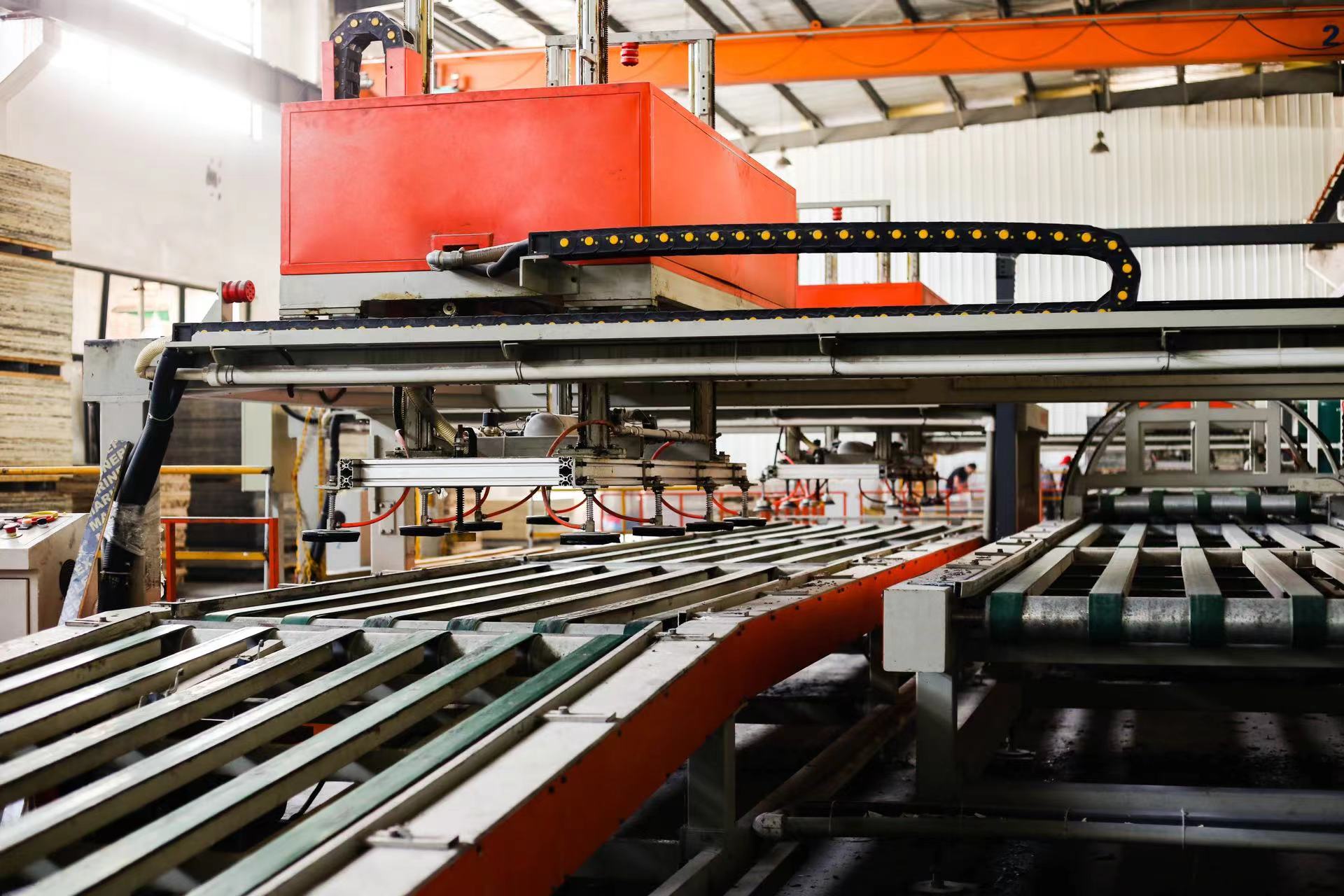 Production equipment with orange overhead assembly
