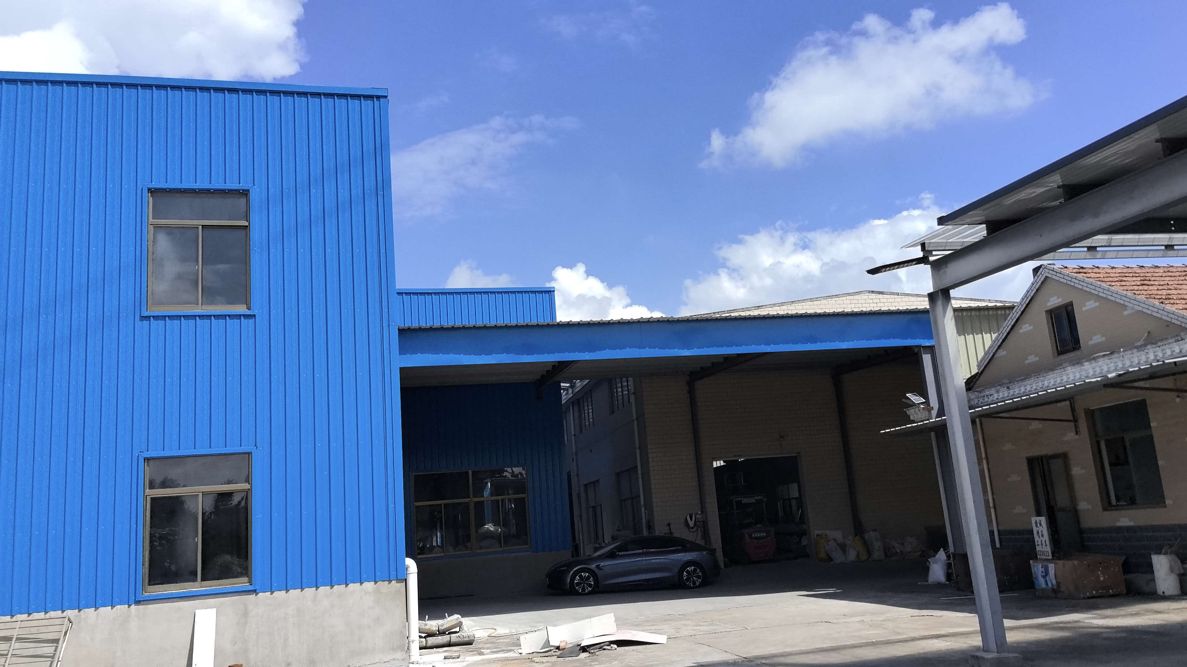 Blue factory building exterior