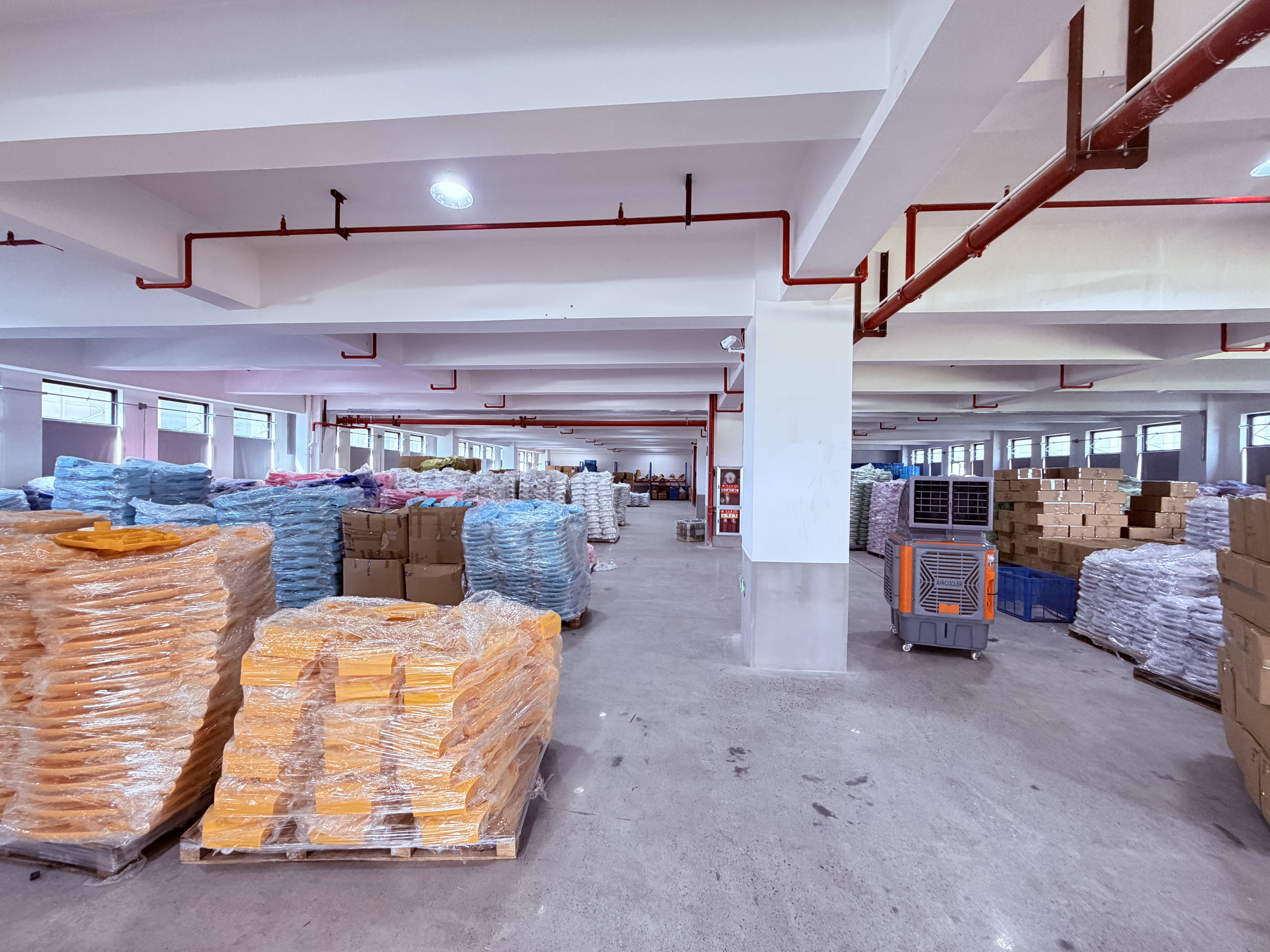 Packed materials, boxes and blue containers in a workroom