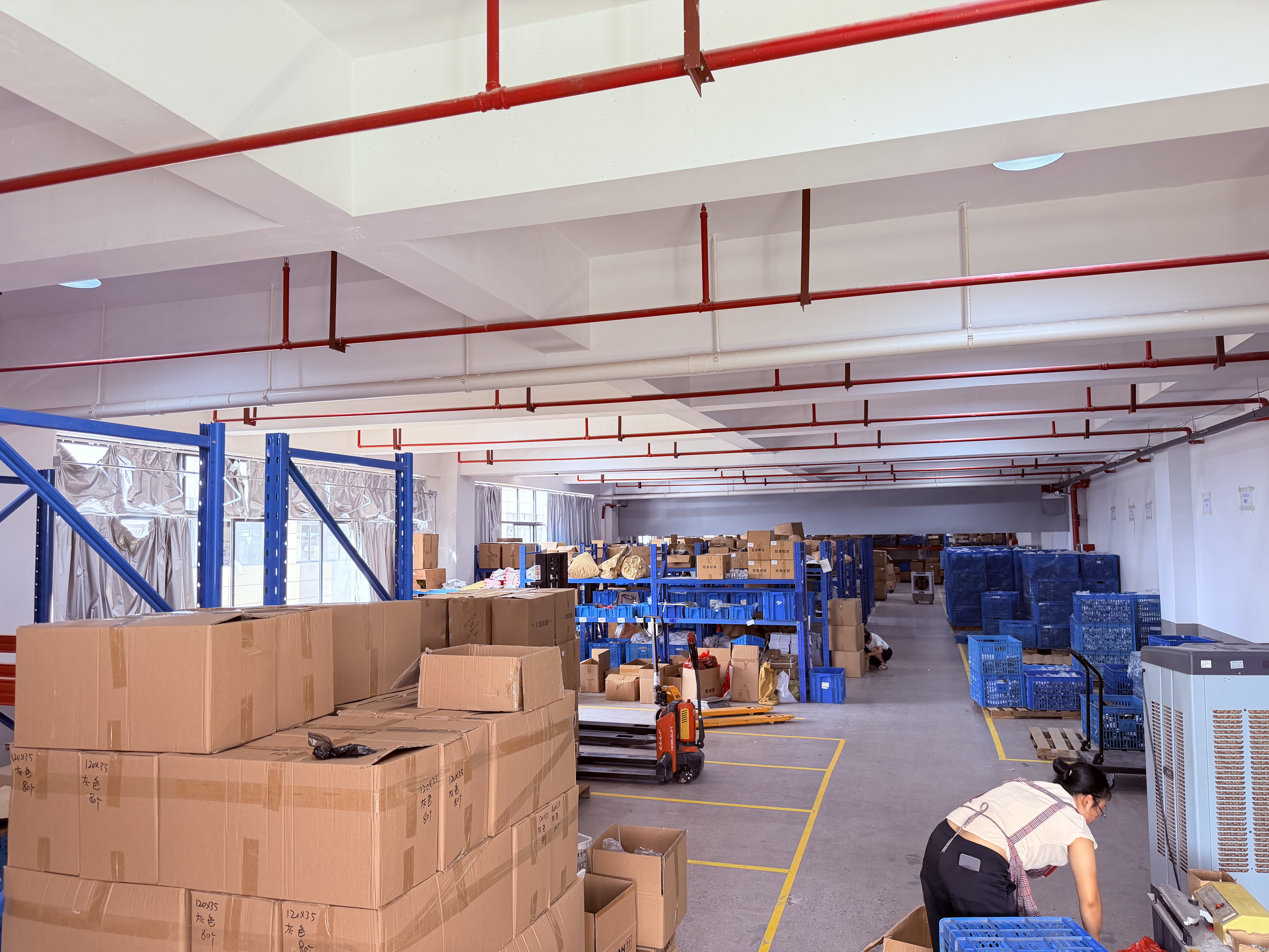 Boxes and blue equipment arranged inside a workroom