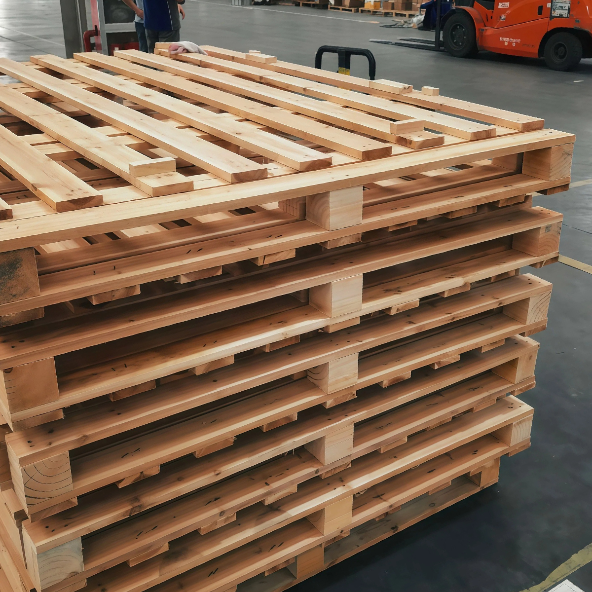 Stacks of solid wooden pallets bundled and ready for dispatch
