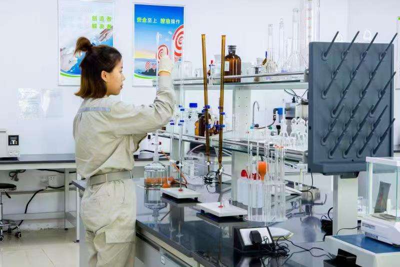 Laboratory technician preparing a material test